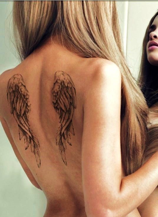 en la espalda - Tatuajes de alas